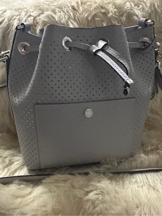 Michael Kors Handbags - Michael Kors Perforated Drawstring Bucket Bag in Gray